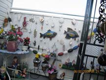 SEA GARDEN: Cliff and Lena Gerhart in their garden, which is filled with beautiful plants and ocean-themed figures.